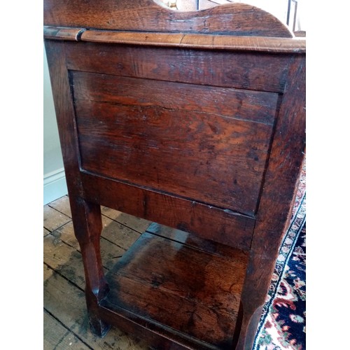 604 - A George III oak high back pot board dresser, the moulded cornice above a scalloped frieze and three... 