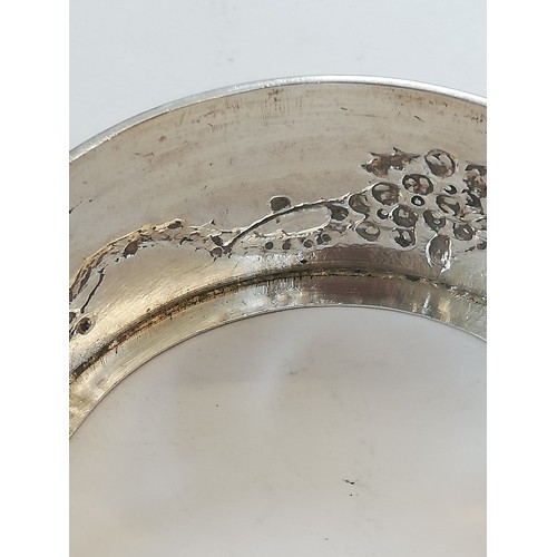 19 - A Chinese silver coloured butter dish, of circular form with detachable cover and circular stand on ... 