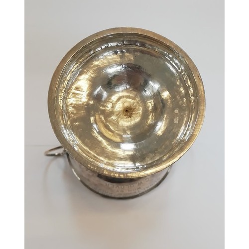 35 - A silver coloured twin-handled trophy cup, the circular bowl with loop handles on tapered stem and s... 
