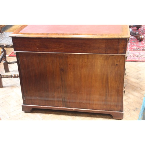 647 - A Victorian mahogany twin-pedestal desk, the rectangular moulded top with a later inset skiver over ... 