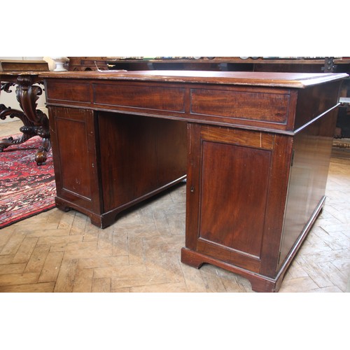 647 - A Victorian mahogany twin-pedestal desk, the rectangular moulded top with a later inset skiver over ... 