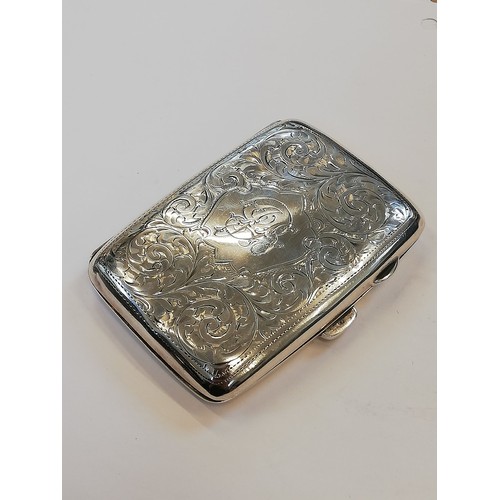 49 - An Art Deco silver cigarette case, Sharman Dermott Neill, Chester 1928, of rectangular faceted form ... 