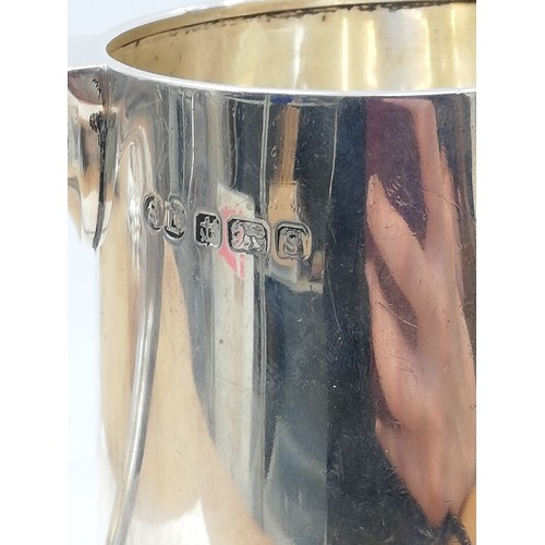 75 - A George VI silver mug, William Suckling Ltd, Birmingham 1942, of tapering cylindrical form on circu... 