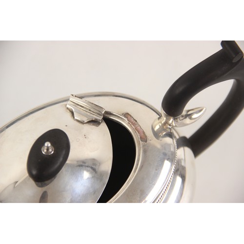 77 - A George V silver teapot, B Street & Co, Birmingham 1930, of compressed oval form with rope twist bo... 