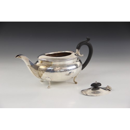 77 - A George V silver teapot, B Street & Co, Birmingham 1930, of compressed oval form with rope twist bo... 