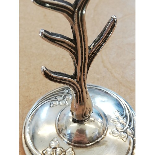 97 - An Art Nouveau silver ring tree, WJ Myatt & Co, Birmingham 1917, the stylized silver tree upon a wei... 