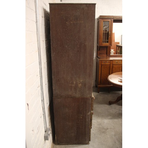 618 - A 19th century scumbled pine housekeepers cupboard, with four panelled cupboard doors above the base... 