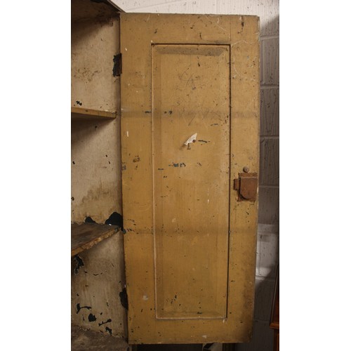 618 - A 19th century scumbled pine housekeepers cupboard, with four panelled cupboard doors above the base... 