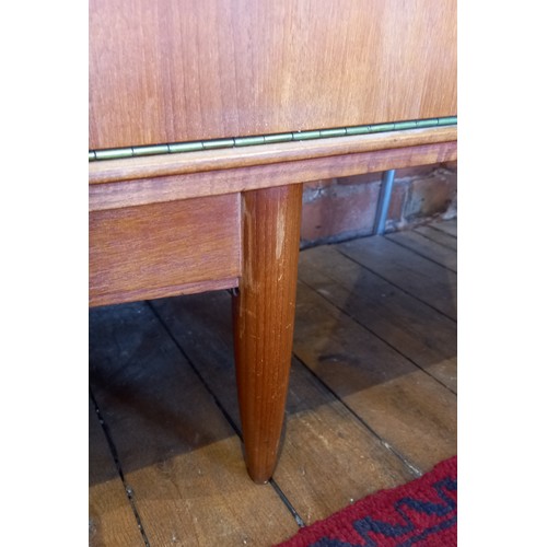 678 - A mid 20th century 'Long John' style teak sideboard, the four central tambour effect drawers flanked... 