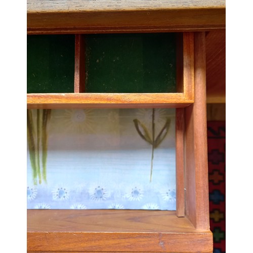 678 - A mid 20th century 'Long John' style teak sideboard, the four central tambour effect drawers flanked... 