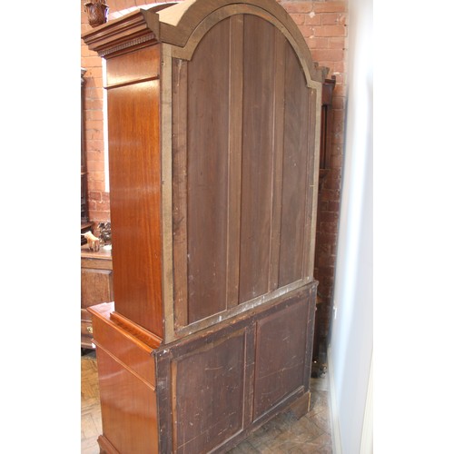 664A - A Queen Anne style mahogany display cabinet, late 20th century, the arched top flanked by fruit fini... 