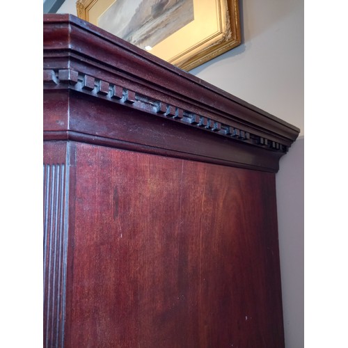 613 - A George III mahogany chest on chest, with a moulded dentil cornice over three short and three long ... 