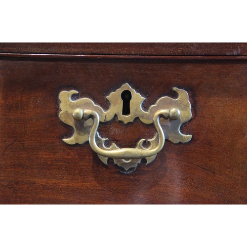 613 - A George III mahogany chest on chest, with a moulded dentil cornice over three short and three long ... 