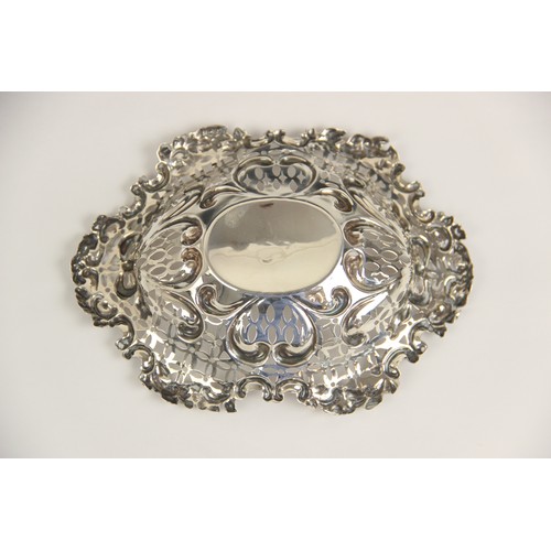 56 - A pair of Victorian silver bon-bon dishes, Henry Matthews, Chester 1895, each of circular form, the ... 