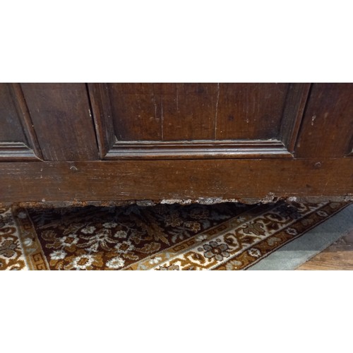 581 - An 18th century and later oak coffer, the rectangular moulded top above three invert moulded front p... 