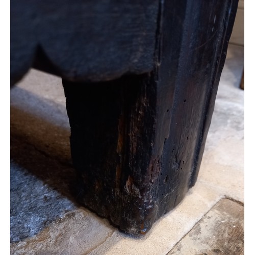 584 - A late 17th century/early 18th century carved oak coffer, the three panel cover opening to a fitted ... 