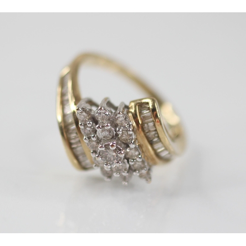 100 - A diamond set 9ct gold cluster ring, the principle round brilliant cut diamond weighing approximatel... 