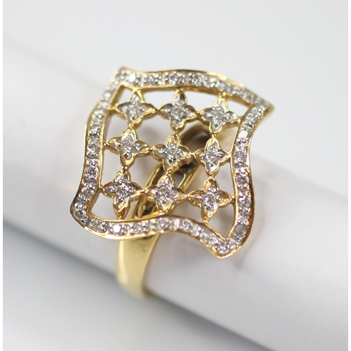 102 - A diamond set swivel head ring, the shaped square head with pierced detail set with round mixed cut ... 