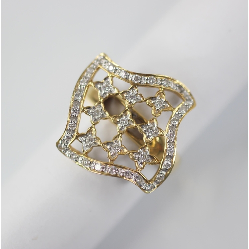 102 - A diamond set swivel head ring, the shaped square head with pierced detail set with round mixed cut ... 