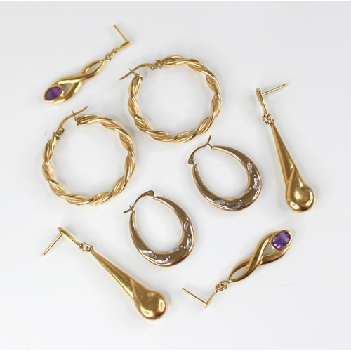 104 - A pair of amethyst set gold coloured drop earrings, each comprising an oval mixed cut amethyst set t... 