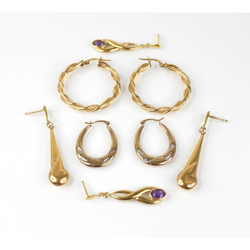 104 - A pair of amethyst set gold coloured drop earrings, each comprising an oval mixed cut amethyst set t... 