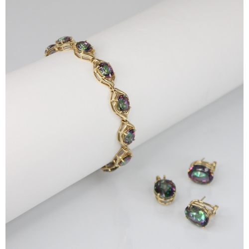 106 - A mystic topaz suite of jewellery, comprising a bracelet, pendant and earrings, the bracelet set wit... 