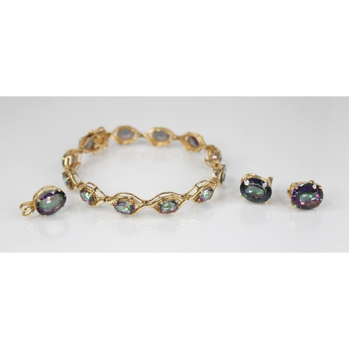 106 - A mystic topaz suite of jewellery, comprising a bracelet, pendant and earrings, the bracelet set wit... 