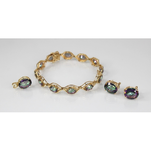 106 - A mystic topaz suite of jewellery, comprising a bracelet, pendant and earrings, the bracelet set wit... 