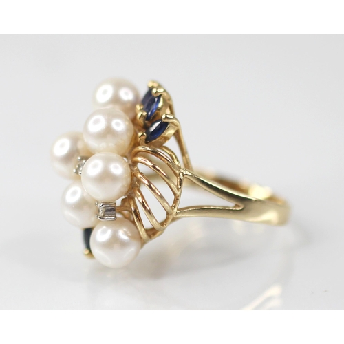 107 - A pearl, sapphire and diamond 14ct gold cocktail ring, designed as six round cultured pearls, inters... 