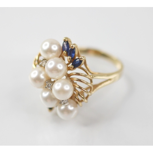 107 - A pearl, sapphire and diamond 14ct gold cocktail ring, designed as six round cultured pearls, inters... 