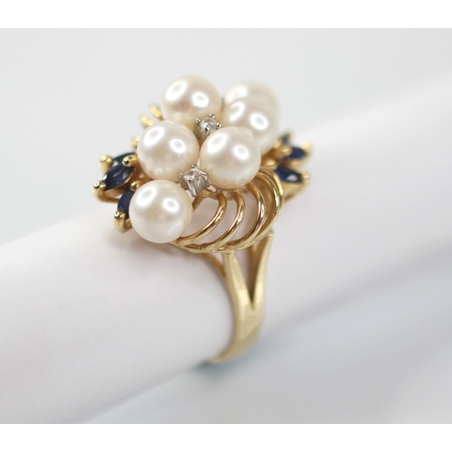 107 - A pearl, sapphire and diamond 14ct gold cocktail ring, designed as six round cultured pearls, inters... 