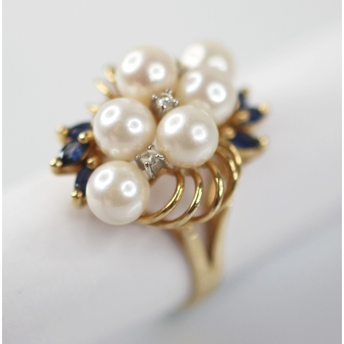 107 - A pearl, sapphire and diamond 14ct gold cocktail ring, designed as six round cultured pearls, inters... 