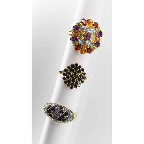 108 - A 14ct gold multi-gem set ring, the oval cluster comprising oval, round and pear cut semi-precious g... 