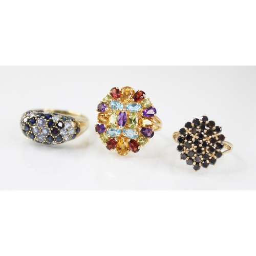 108 - A 14ct gold multi-gem set ring, the oval cluster comprising oval, round and pear cut semi-precious g... 