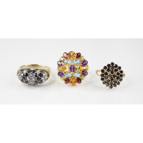 108 - A 14ct gold multi-gem set ring, the oval cluster comprising oval, round and pear cut semi-precious g... 