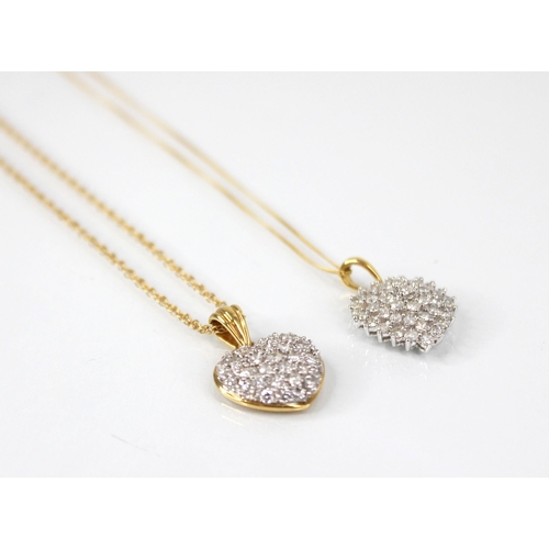 112 - A diamond set 18ct gold heart-shaped pendant, designed as a tiered cluster of round brilliant cut di... 