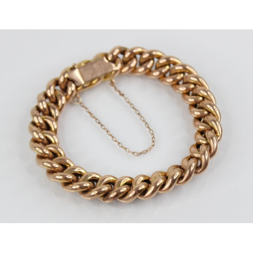 122 - A Victorian gold coloured curb link bracelet, tongue and box snap clasp fastening, tongue stamped '9... 