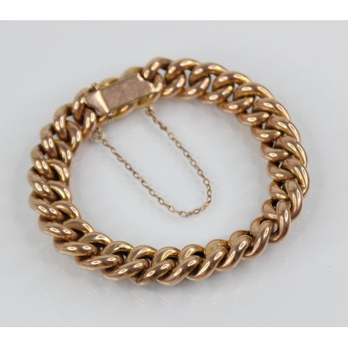 122 - A Victorian gold coloured curb link bracelet, tongue and box snap clasp fastening, tongue stamped '9... 