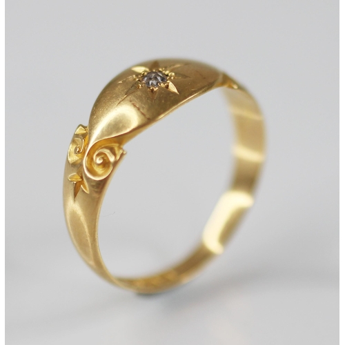 126 - An Edwardian diamond set 18ct gold ring, the central single cut diamond gypsy star set to a navette ... 