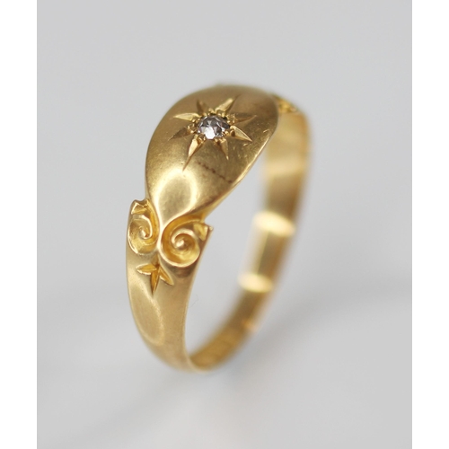 126 - An Edwardian diamond set 18ct gold ring, the central single cut diamond gypsy star set to a navette ... 