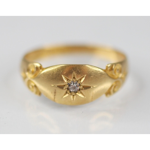 126 - An Edwardian diamond set 18ct gold ring, the central single cut diamond gypsy star set to a navette ... 