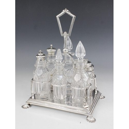 13 - A Victorian silver plated cruet by Latham & Morton, the rectangular base with six divisions and face... 
