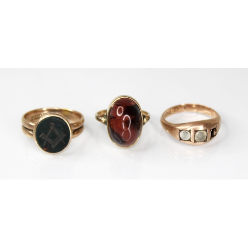 131 - A Victorian 9ct gold bloodstone set Masonic ring, the oval bloodstone head engraved with compass and... 