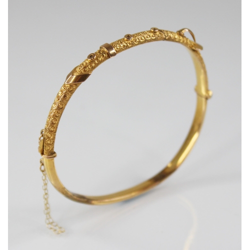 132 - An early 20th century 9ct gold bangle, possibly Smith & Pepper Ltd, Birmingham (date letter worn), o... 