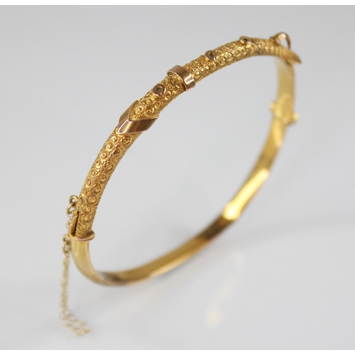 132 - An early 20th century 9ct gold bangle, possibly Smith & Pepper Ltd, Birmingham (date letter worn), o... 