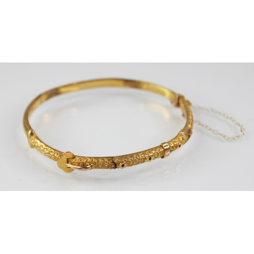 132 - An early 20th century 9ct gold bangle, possibly Smith & Pepper Ltd, Birmingham (date letter worn), o... 