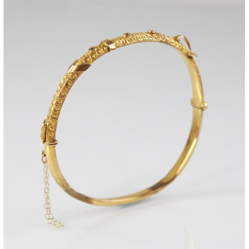 132 - An early 20th century 9ct gold bangle, possibly Smith & Pepper Ltd, Birmingham (date letter worn), o... 