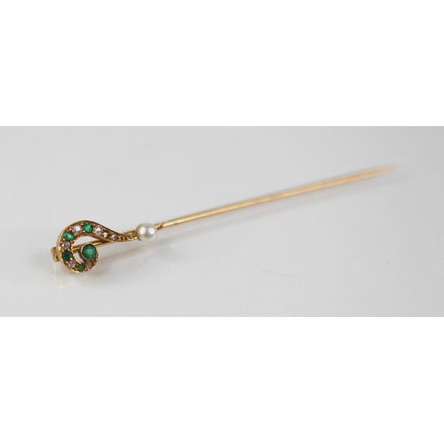 135 - A novelty diamond, emerald and pearl stick pin, modelled as a question mark, set with mixed cut diam... 