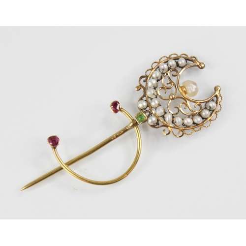 136 - A 19th century French pearl, peridot and ruby set 18ct gold stick pin, modelled as a crescent moon w... 