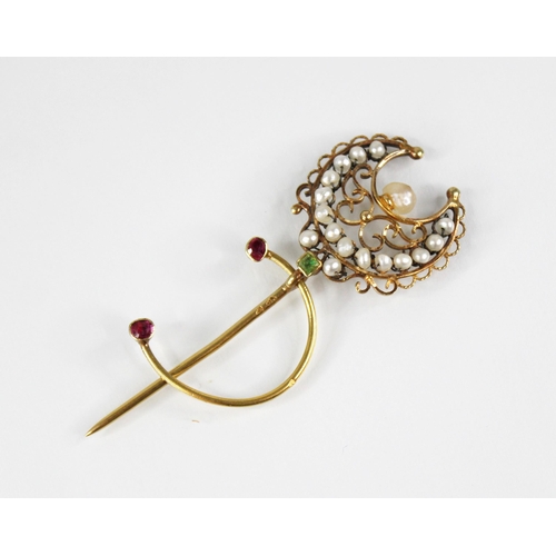 136 - A 19th century French pearl, peridot and ruby set 18ct gold stick pin, modelled as a crescent moon w... 